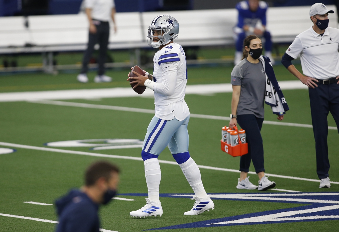 Oct 11, 2020; Arlington, Texas, USA; Dallas Cowboys quarterback Dak Prescott (4) throws a pass before the game against the New York Giants at AT&T Stadium. Mandatory Credit: Tim Heitman-USA TODAY Sports