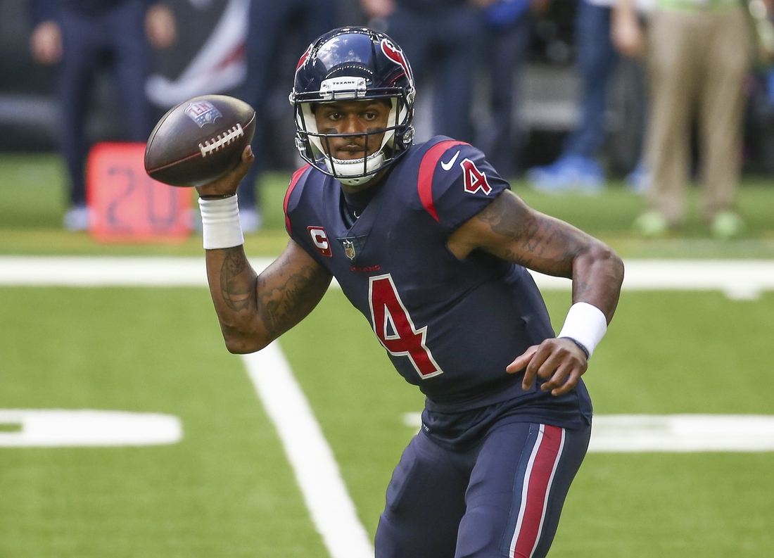 Dec 27, 2020; Houston, Texas, USA; Houston Texans quarterback Deshaun Watson (4) rolls out of the pocket against the Cincinnati Bengals during the third quarter at NRG Stadium. Mandatory Credit: Troy Taormina-USA TODAY Sports