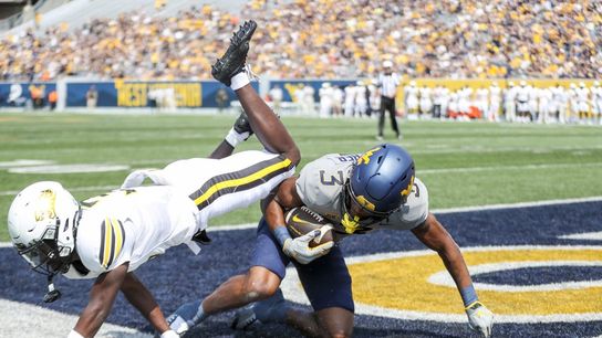 West Virginia scores on every drive in 65-7 rout of Towson (College Football)