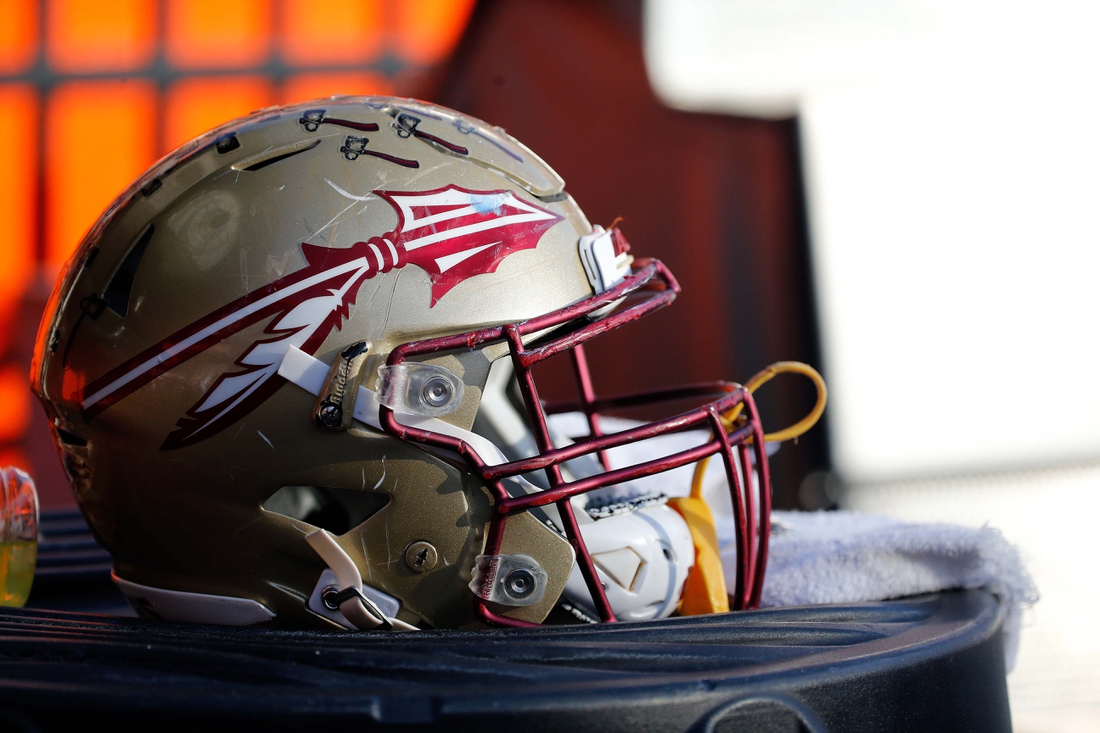 Nov 25, 2017; Gainesville, FL, USA; Florida State Seminoles helmet lays on the field against the Florida Gators during the second half at Ben Hill Griffin Stadium. Mandatory Credit: Kim Klement-USA TODAY Sports