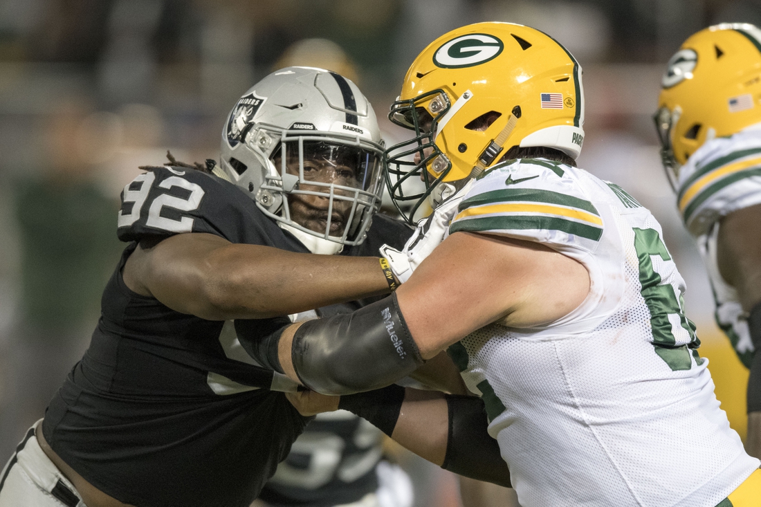 August 24, 2018; Oakland, CA, USA; Oakland Raiders nose tackle P.J. Hall (92) blocks Green Bay Packers offensive guard Lucas Patrick (62) during the first quarter at Oakland Coliseum. Mandatory Credit: Kyle Terada-USA TODAY Sports