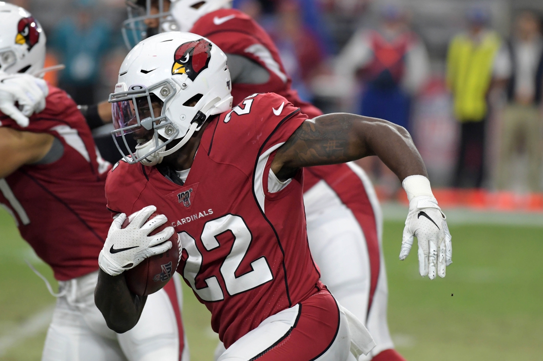Aug 15, 2019; Glendale, AZ, USA; Arizona Cardinals running back T.J. Logan (22) carries the ball against the Oakland Raiders during an NFL football game. The Raiders defeated the Cardinals 33-26. Mandatory Credit: Kirby Lee-USA TODAY Sports