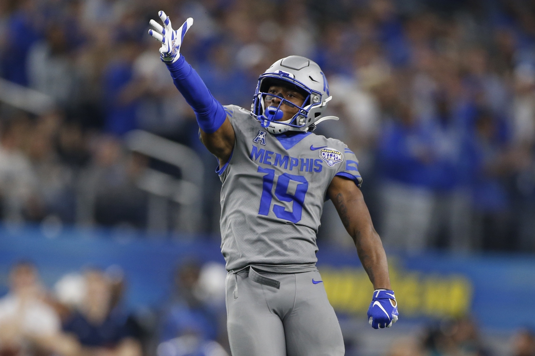 Dec 28, 2019; Arlington, Texas, USA; Memphis Tigers running back Kenneth Gainwell (19) reacts to a first down in the third quarter against the Penn State Nittany Lions at AT&T Stadium. Mandatory Credit: Tim Heitman-USA TODAY Sports