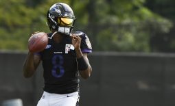 Aug 17, 2020; Owings Mills, Maryland, USA;  Baltimore Ravens quarterback Lamar Jackson (8) looks to throw during morning practice at Under Armour Performance Center. Mandatory Credit: Tommy Gilligan-USA TODAY Sports