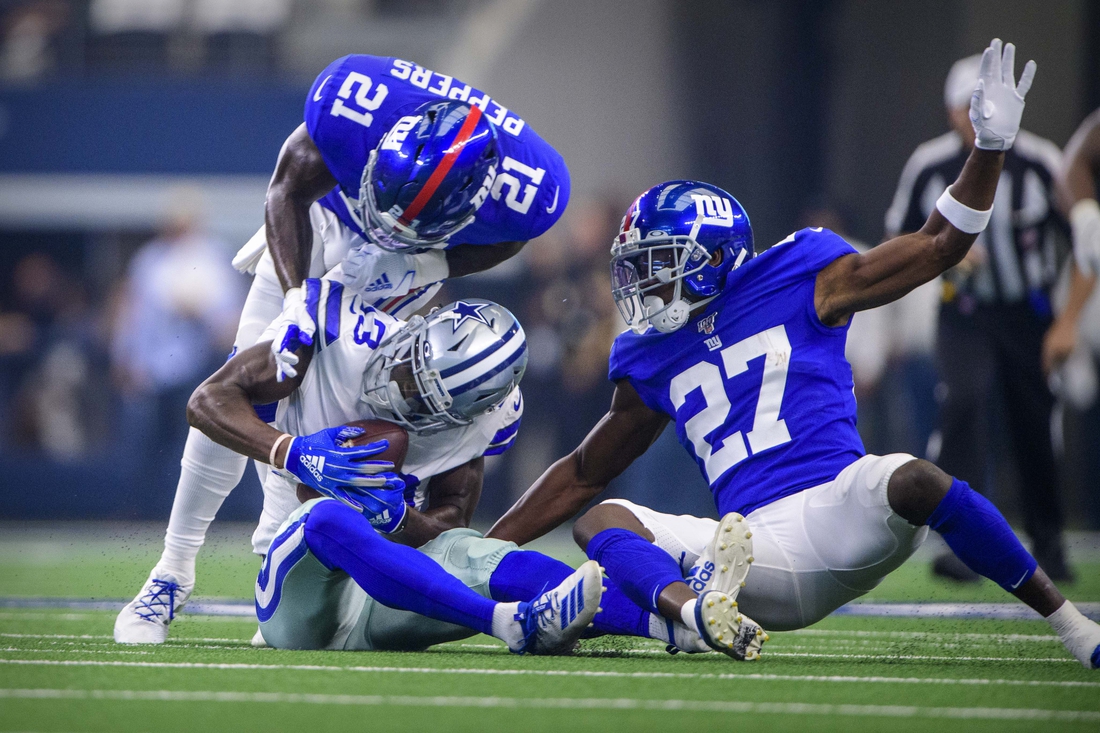 Sep 8, 2019; Arlington, TX, USA; Dallas Cowboys wide receiver Michael Gallup (13) and New York Giants cornerback Deandre Baker (27) and free safety Jabrill Peppers (21) in action during the game between the Cowboys and the Giants at AT&T Stadium. Mandatory Credit: Jerome Miron-USA TODAY Sports