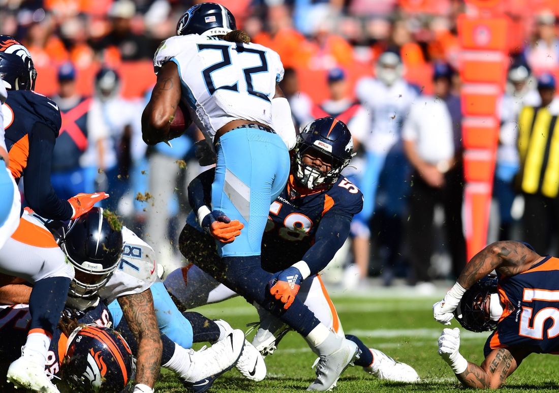 Oct 13, 2019; Denver, CO, USA; Denver Broncos linebacker Von Miller (58) tackles Tennessee Titans running back Derrick Henry (22) in the second quarter at Empower Field at Mile High. Mandatory Credit: Ron Chenoy-USA TODAY Sports