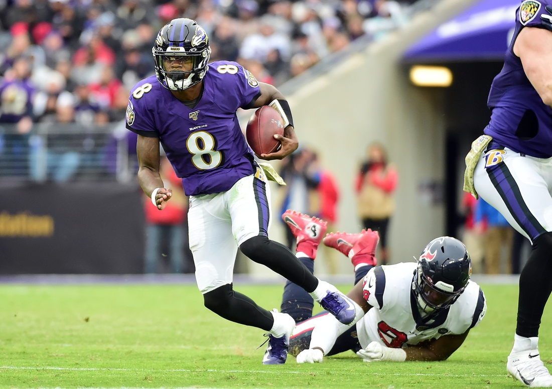 Nov 17, 2019; Baltimore, MD, USA; Baltimore Ravens quarterback Lamar Jackson (8) carries the ball in the third quarter against the Houston Texans at M&T Bank Stadium. Mandatory Credit: Evan Habeeb-USA TODAY Sports