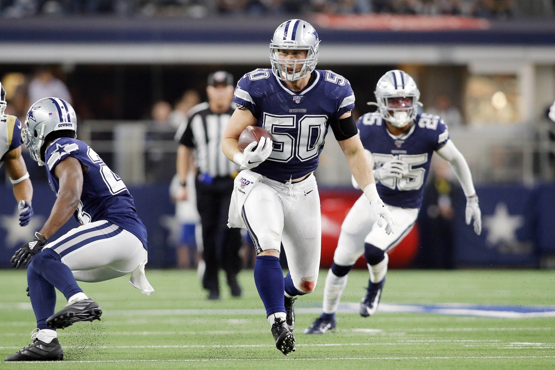 Dec 15, 2019; Arlington, TX, USA; Dallas Cowboys outside linebacker Sean Lee (50) returns an interception in the second quarter against the Los Angeles Rams at AT&T Stadium. Mandatory Credit: Tim Heitman-USA TODAY Sports
