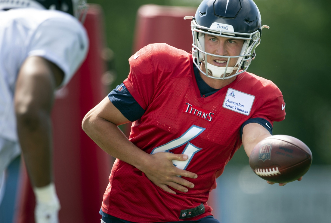 Aug 20, 2020; Nashville, TN, USA; Tennessee Titans quarterback Trevor Siemian (4) hands the ball off during a training camp practice at Saint Thomas Sports Park Thursday, Aug. 20, 2020 in Nashville, Tenn. Mandatory Credit: George Walker IV/The Tennessean via USA TODAY NETWORK