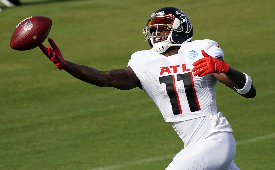 Aug 26, 2020; Flowery Branch, GA, USA;   Atlanta Falcons wide receiver Julio Jones (11) catches a ball during an NFL football training camp practice on Wednesday, Aug. 26, 2020, in Flowery Branch, Ga. Mandatory Credit: Brynn Anderson/Pool Photo-USA TODAY Sports