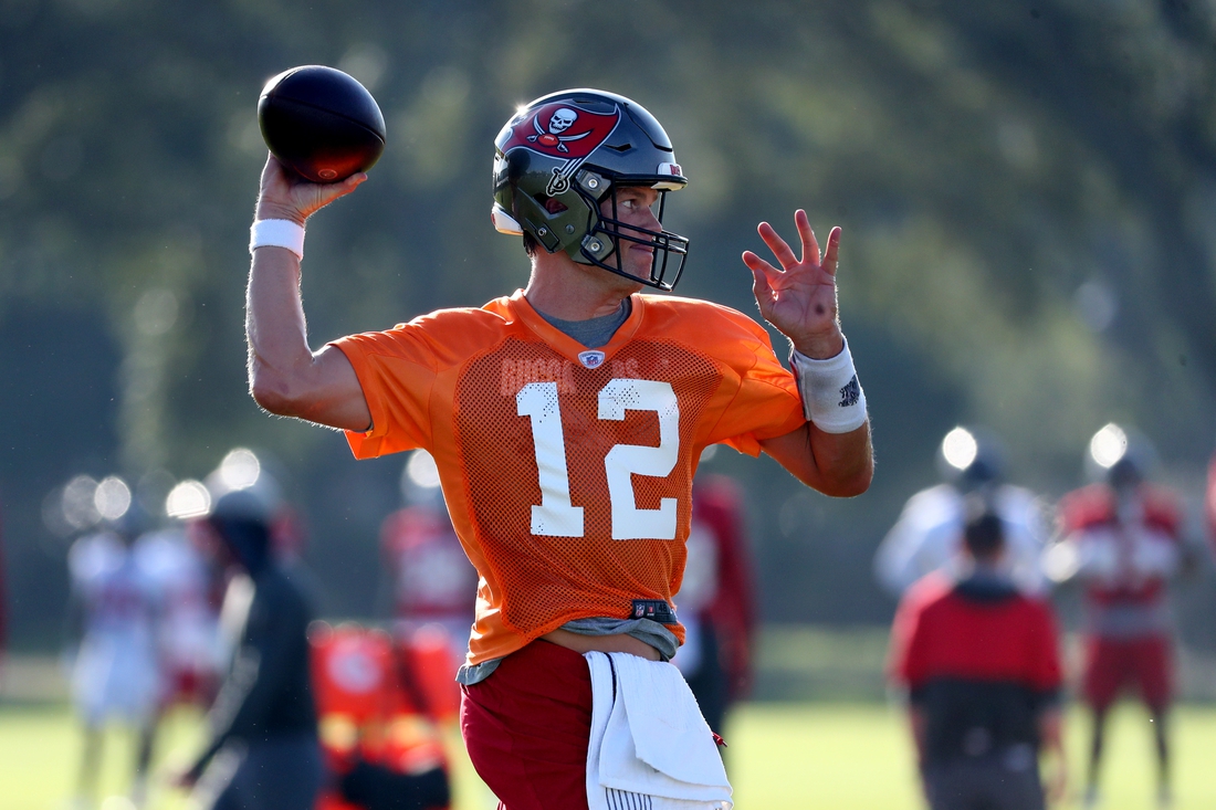 Sep 2, 2020; Tampa, Florida, USA;  Tampa Bay Buccaneers quarterback Tom Brady (12) works out at AdventHealth Training Center. Mandatory Credit: Kim Klement-USA TODAY Sports