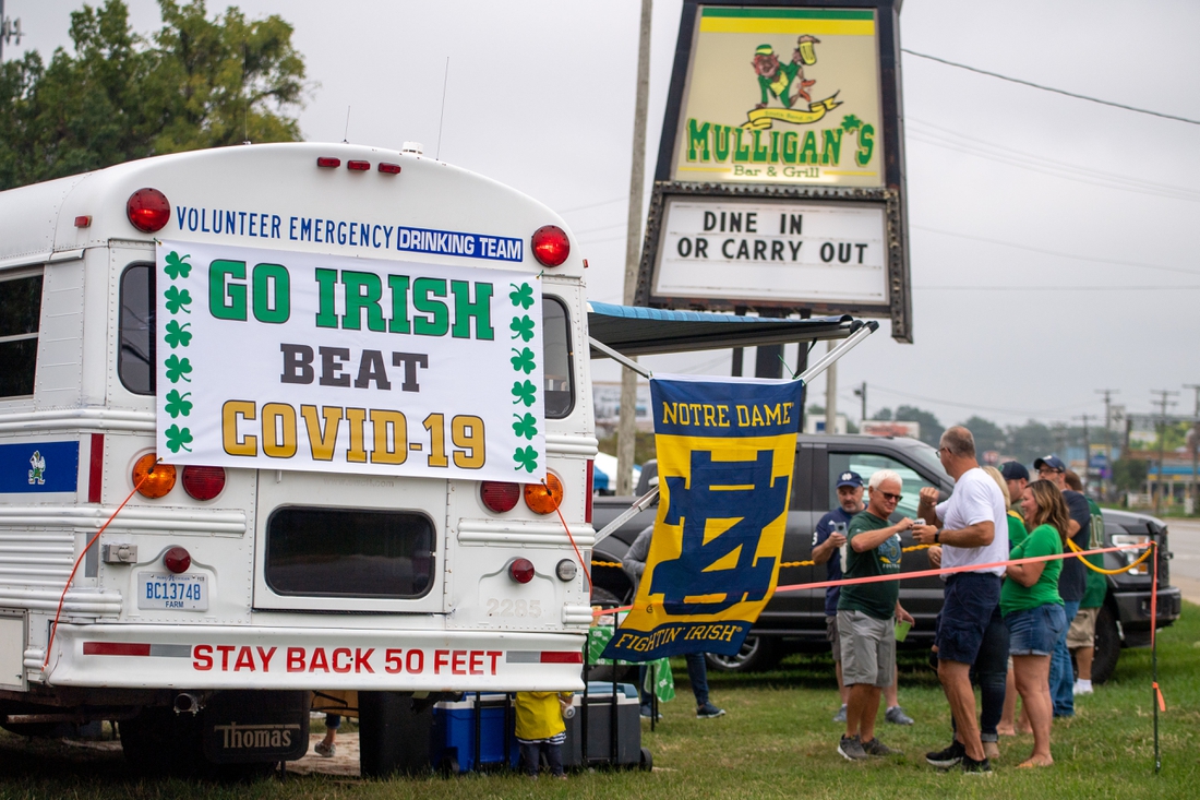 Sep 12, 2020; Notre Dame, Indiana, USA; Fans gather off-campus for the game between the Notre Dame Fighting Irish and the Duke Blue Devils at Notre Dame Stadium. Notre Dame limited seating capacity and banned tailgating on campus as part of its COVID-19 protocols. Mandatory Credit: Matt Cashore-USA TODAY Sports