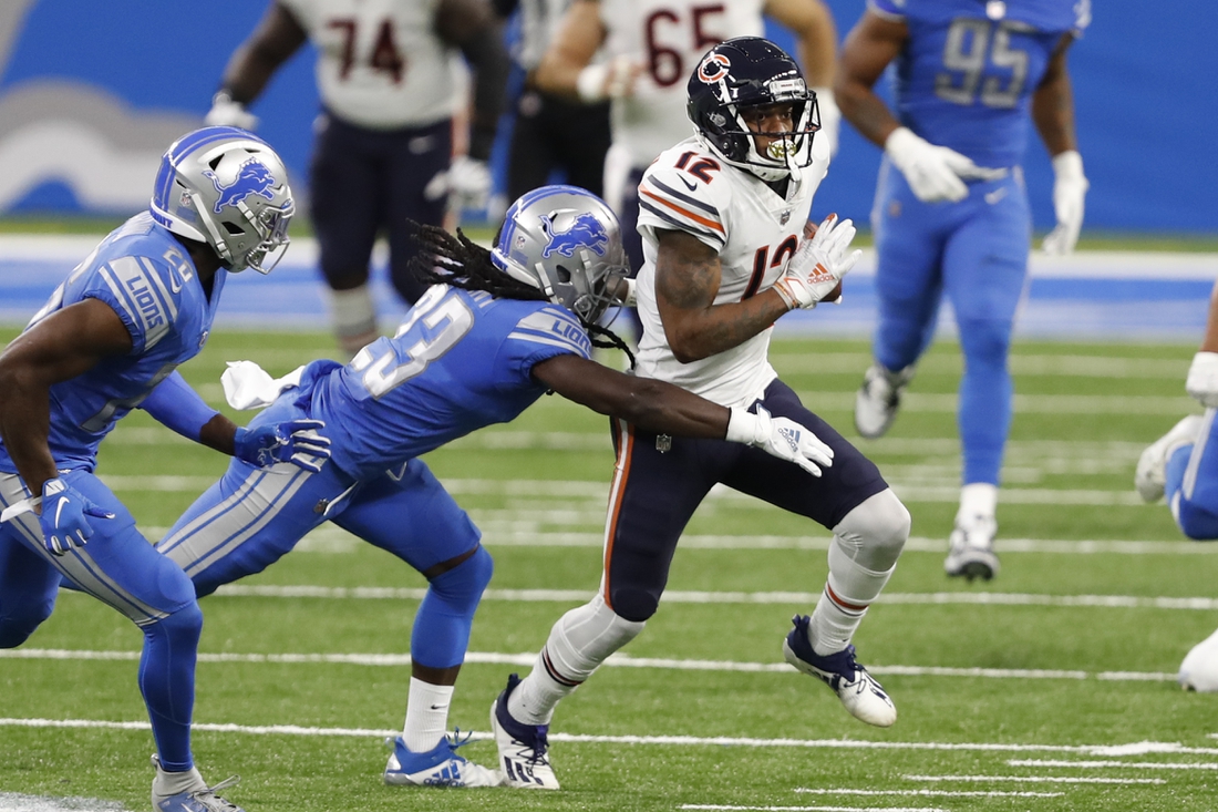 Sep 13, 2020; Detroit, Michigan, USA; Chicago Bears wide receiver Allen Robinson (12) runs after a catch against Detroit Lions cornerback Desmond Trufant (23) during the second quarter at Ford Field. Mandatory Credit: Raj Mehta-USA TODAY Sports