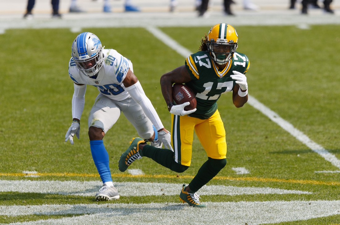 Sep 20, 2020; Green Bay, Wisconsin, USA;  Green Bay Packers wide receiver Davante Adams (17) rushes with the football after catching a pass during the second quarter against the Detroit Lions at Lambeau Field. Mandatory Credit: Jeff Hanisch-USA TODAY Sports