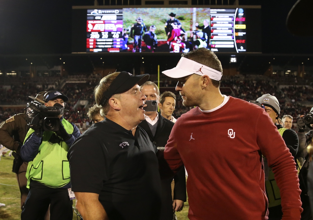 Nov 23, 2019; Norman, OK, USA; Oklahoma Sooners head coach Lincoln Riley (right) greets TCU Horned Frogs head coach Gary Patterson after the game at Gaylord Family - Oklahoma Memorial Stadium. Mandatory Credit: Kevin Jairaj-USA TODAY Sports