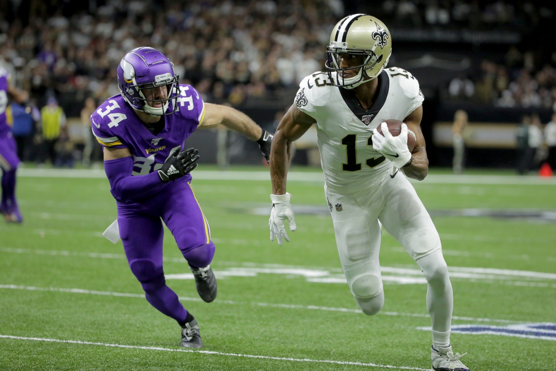 Jan 5, 2020; New Orleans, Louisiana, USA; New Orleans Saints wide receiver Michael Thomas (13) runs after a pass reception against Minnesota Vikings strong safety Andrew Sendejo (34) during the first quarter of a NFC Wild Card playoff football game at the Mercedes-Benz Superdome. Mandatory Credit: Derick Hingle-USA TODAY Sports