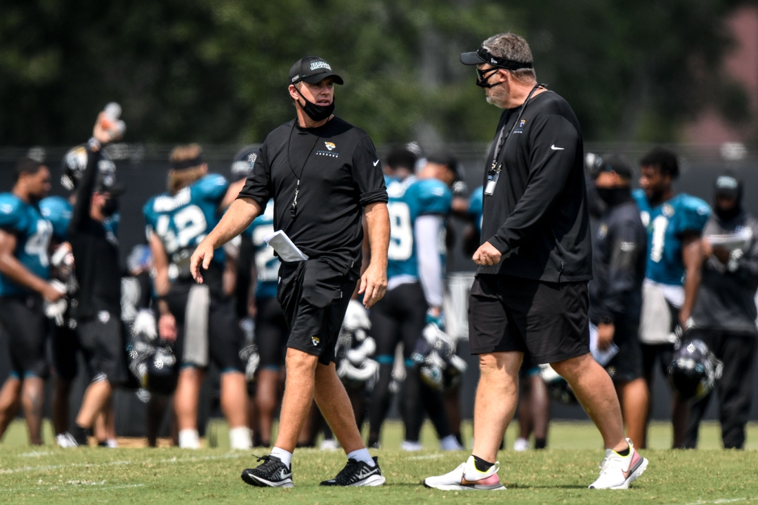 Aug 17, 2020; Jacksonville, Florida, USA; Jacksonville Jaguars offensive coordinator Jay Gruden (left) and head coach Doug Marrone (right) interact during training camp at Dream Finders Homes Practice Complex. Mandatory Credit: Douglas DeFelice-USA TODAY Sports
