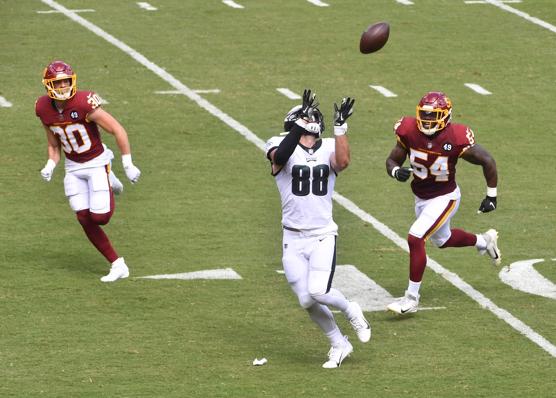 Sep 13, 2020; Landover, Maryland, USA; Philadelphia Eagles tight end Dallas Goedert (88) catches a touchdown pass as Washington Football Team safety Troy Apke (30) and linebacker Kevin Pierre-Louis (54) defend during the first half quarter at FedExField. Mandatory Credit: Brad Mills-USA TODAY Sports