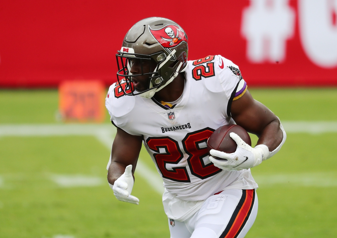 Sep 20, 2020; Tampa, Florida, USA;  Tampa Bay Buccaneers running back Leonard Fournette (28) runs the ball against the Carolina Panthers during the second quarter at Raymond James Stadium. Mandatory Credit: Kim Klement-USA TODAY Sports