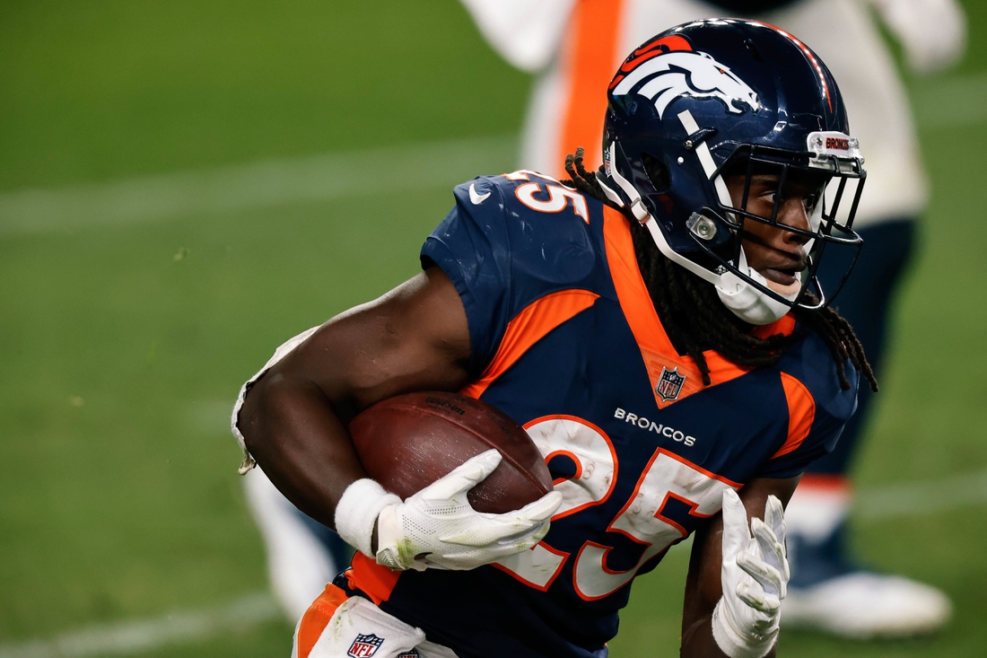 Sep 14, 2020; Denver, Colorado, USA; Denver Broncos running back Melvin Gordon III (25) runs the ball on a catch in the fourth quarter against the Tennessee Titans at Empower Field at Mile High. Mandatory Credit: Isaiah J. Downing-USA TODAY Sports