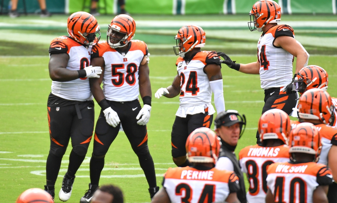 Sep 27, 2020; Philadelphia, Pennsylvania, USA; Cincinnati Bengals defensive end Carl Lawson (58) celebrates his sack with nose tackle D.J. Reader (98) against the Philadelphia Eagles during the first quarter at Lincoln Financial Field. Mandatory Credit: Eric Hartline-USA TODAY Sports