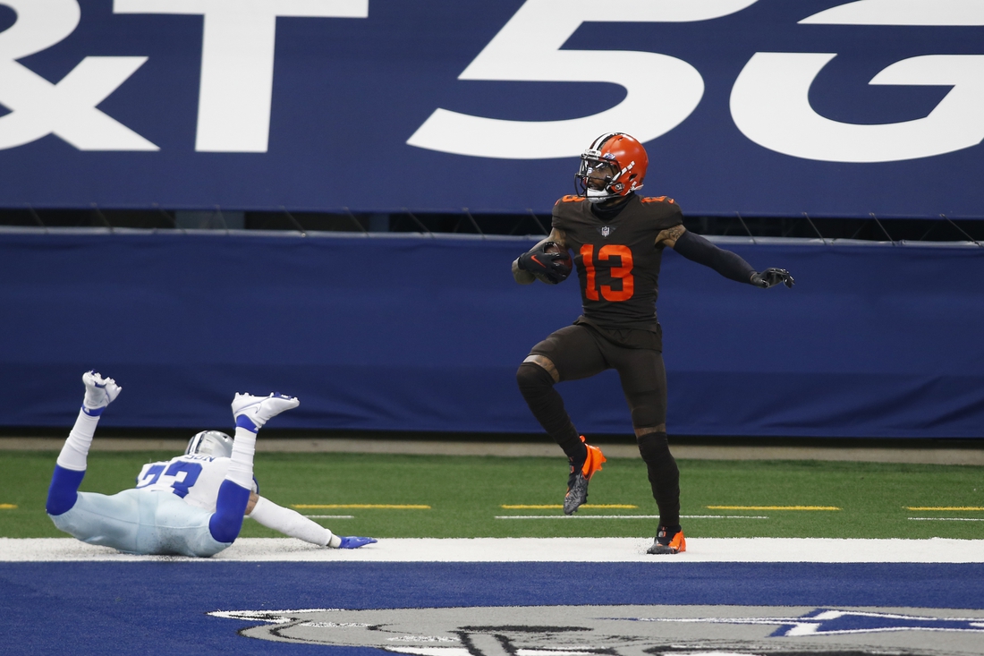 Oct 4, 2020; Arlington, Texas, USA; Cleveland Browns wide receiver Odell Beckham Jr. (13) catches a touchdown pass against Dallas Cowboys strong safety Darian Thompson (23) in the first quarter at AT&T Stadium. Mandatory Credit: Tim Heitman-USA TODAY Sports