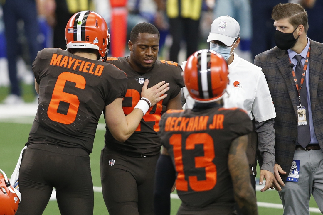 Oct 4, 2020; Arlington, Texas, USA; Cleveland Browns running back Nick Chubb (24) leaves the field with an injury as quarterback Baker Mayfield (6) talks to him in the first quarter against the Dallas Cowboys at AT&T Stadium. Mandatory Credit: Tim Heitman-USA TODAY Sports