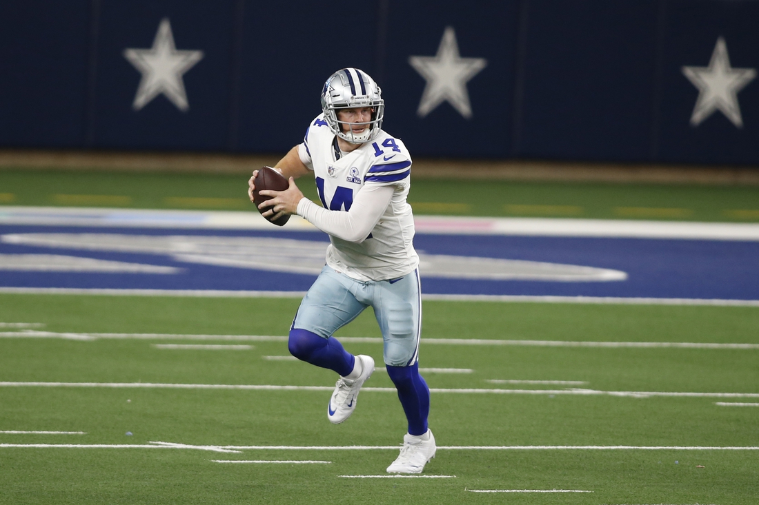 Oct 11, 2020; Arlington, Texas, USA; Dallas Cowboys quarterback Andy Dalton (14) rolls out in the fourth quarter against the New York Giants at AT&T Stadium. Mandatory Credit: Tim Heitman-USA TODAY Sports
