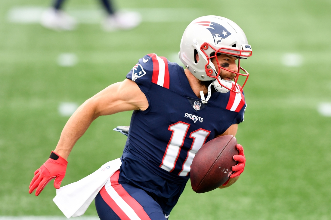 Oct 25, 2020; Foxborough, Massachusetts, USA; New England Patriots wide receiver Julian Edelman (11) runs with the ball during warmups before a game against the San Francisco 49ers at Gillette Stadium. Mandatory Credit: Brian Fluharty-USA TODAY Sports