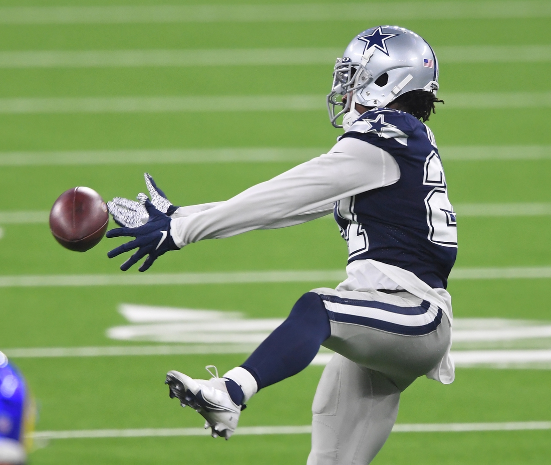 Dallas Cowboys cornerback Trevon Diggs (27) barley misses an interception in the second half of the game against the Los Angeles Rams at SoFi Stadium. Mandatory Credit: Jayne Kamin-Oncea-USA TODAY Sports
