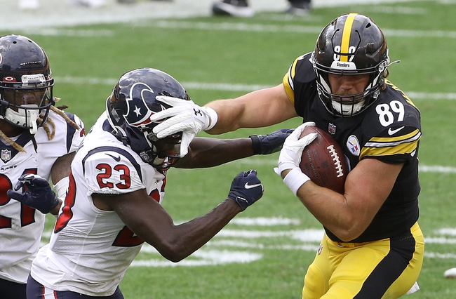 Sep 27, 2020; Pittsburgh, Pennsylvania, USA;  Pittsburgh Steelers tight end Vance McDonald (89) stiff arms Houston Texans free safety Eric Murray (23) after a catch during the fourth quarter at Heinz Field.The Steelers won 28-21.  Mandatory Credit: Charles LeClaire-USA TODAY Sports