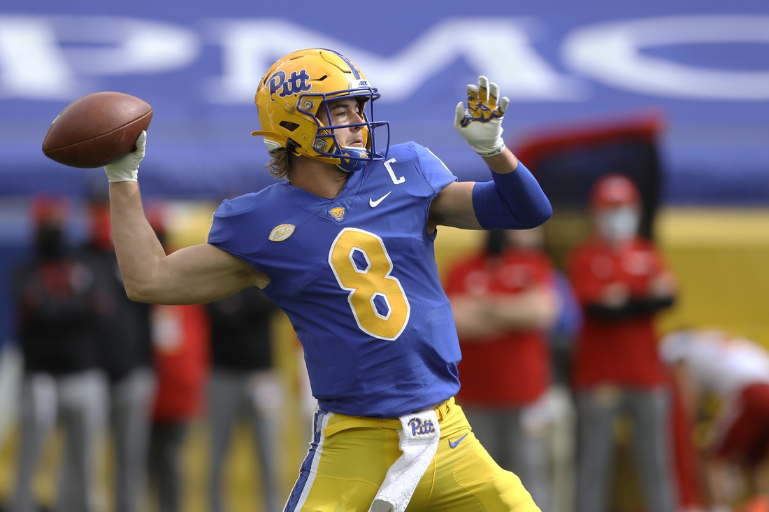 Oct 3, 2020; Pittsburgh, Pennsylvania, USA;  Pittsburgh Panthers quarterback Kenny Pickett (8) passes against the North Carolina State Wolfpack during the first quarter at Heinz Field. Mandatory Credit: Charles LeClaire-USA TODAY Sports
