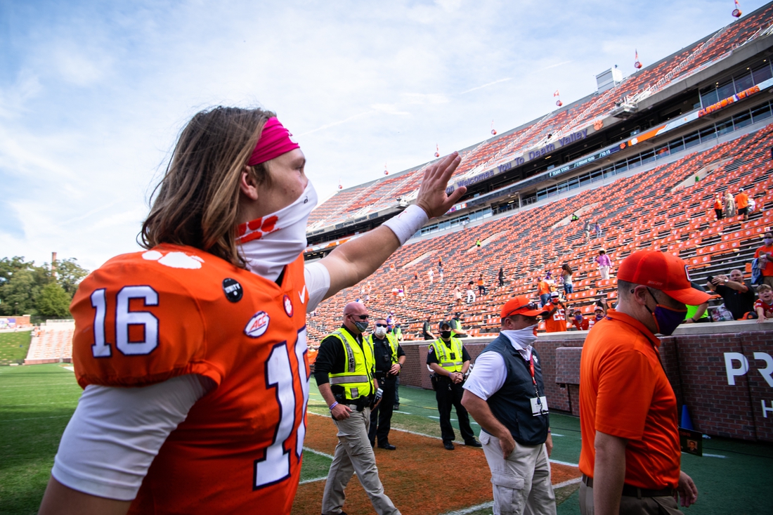 Oct 24, 2020; Clemson, South Carolina, USA;   Clemson quarterback Trevor Lawrence (16) waves to fans after their game against Syracuse at Memorial Stadium. Mandatory Credit: Ken Ruinard-USA TODAY Sports