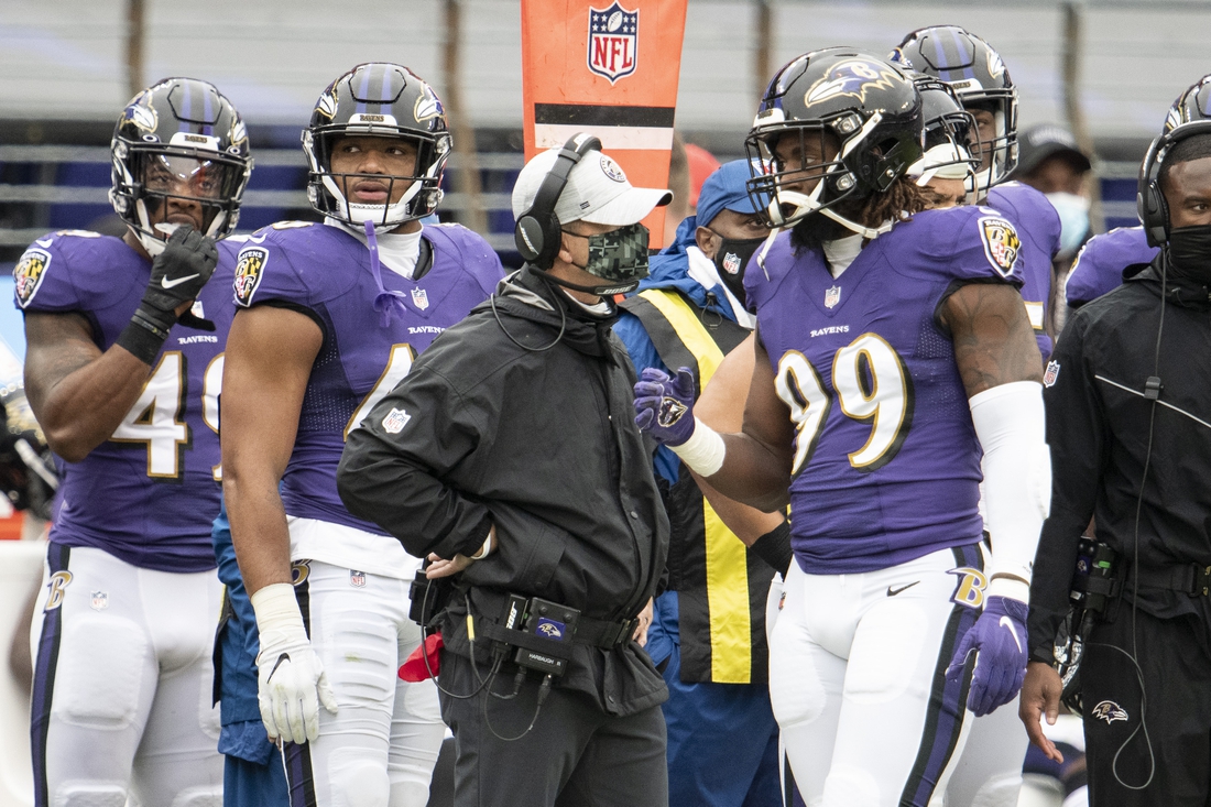 Nov 1, 2020; Baltimore, Maryland, USA;  Baltimore Ravens head coach John Harbaugh speaks with outside linebacker Matt Judon (99) after being ejected from the game during the first half against the Pittsburgh Steelers at M&T Bank Stadium. Mandatory Credit: Tommy Gilligan-USA TODAY Sports