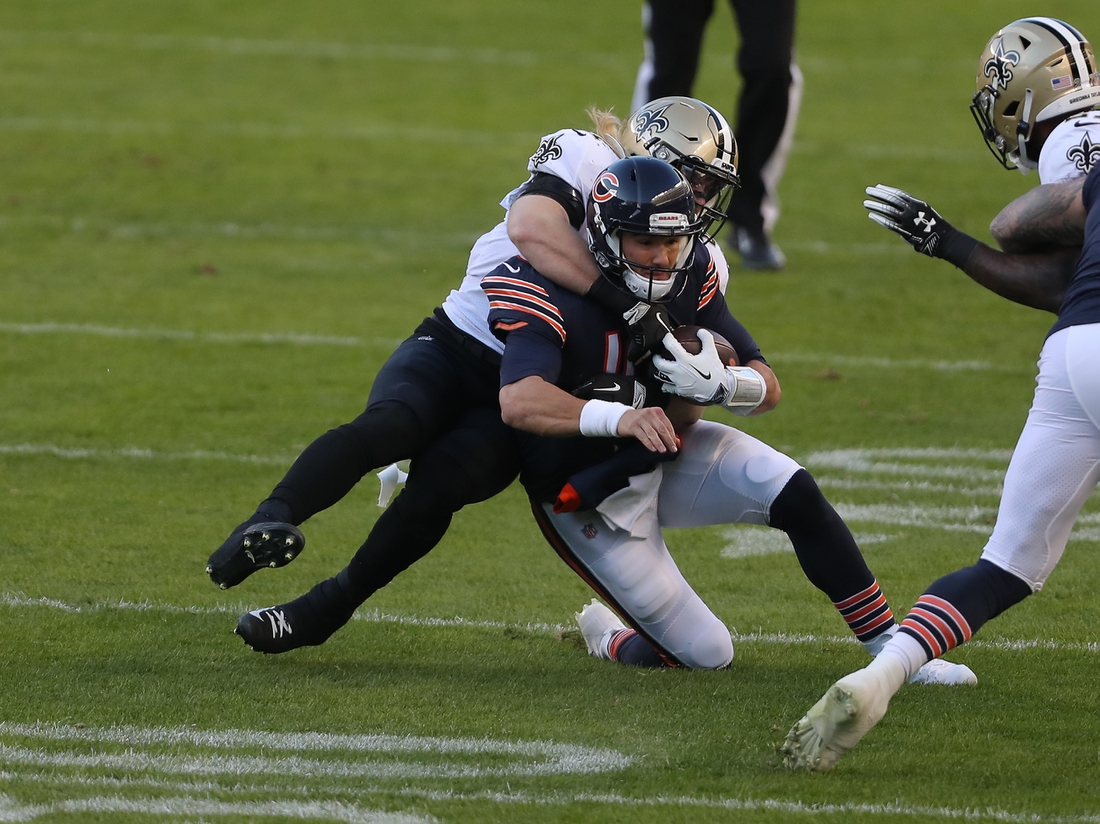 Nov 1, 2020; Chicago, Illinois, USA; Chicago Bears quarterback Mitchell Trubisky (10) is tackled by New Orleans Saints middle linebacker Alex Anzalone (47) during the first quarter at Soldier Field. Mandatory Credit: Dennis Wierzbicki-USA TODAY Sports