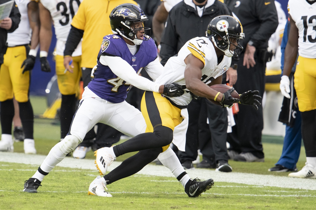Nov 1, 2020; Baltimore, Maryland, USA;  Pittsburgh Steelers wide receiver JuJu Smith-Schuster (19) cuts to the sideline as Baltimore Ravens cornerback Marlon Humphrey (44) attempt to tackle during the second half at M&T Bank Stadium. Mandatory Credit: Tommy Gilligan-USA TODAY Sports