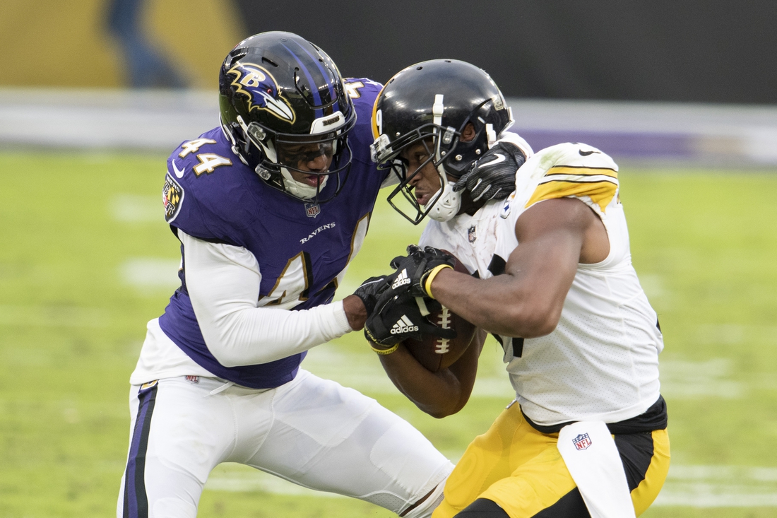 Nov 1, 2020; Baltimore, Maryland, USA;  Pittsburgh Steelers wide receiver JuJu Smith-Schuster (19) fights for extra yards as Baltimore Ravens cornerback Marlon Humphrey (44) defends during the second half at M&T Bank Stadium. Mandatory Credit: Tommy Gilligan-USA TODAY Sports