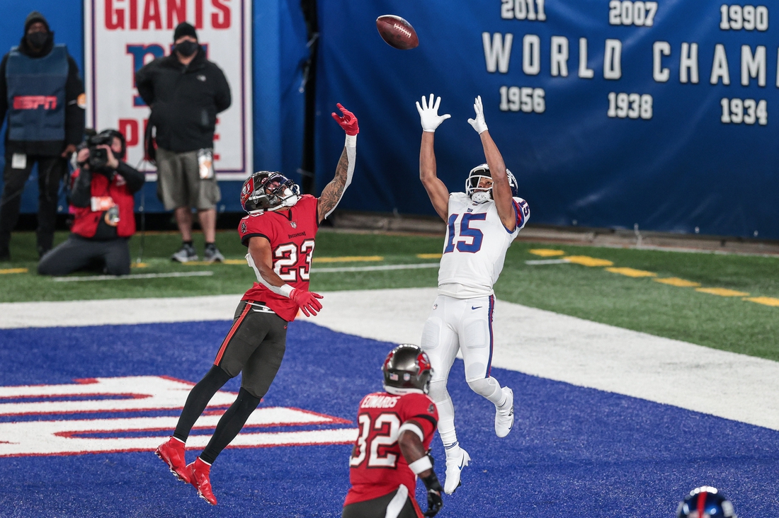 Nov 2, 2020; East Rutherford, New Jersey, USA; New York Giants wide receiver Golden Tate (15) catches a touchdown pass in front of Tampa Bay Buccaneers cornerback Sean Murphy-Bunting (23) during the second half at MetLife Stadium. Mandatory Credit: Vincent Carchietta-USA TODAY Sports