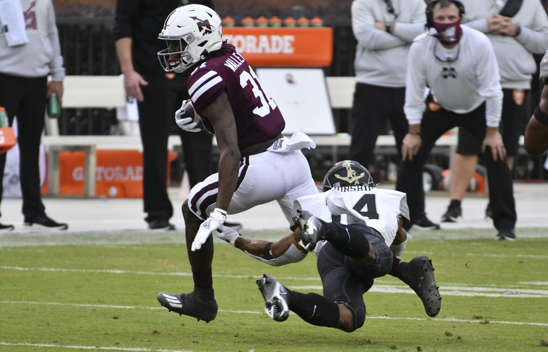 Nov 7, 2020; Starkville, Mississippi, USA; Mississippi State Bulldogs wide receiver Jaden Walley (31) runs with the ball while defended by Vanderbilt Commodores safety Maxwell Worship (R) during the second quarter at Davis Wade Stadium at Scott Field. Mandatory Credit: Matt Bush-USA TODAY Sports