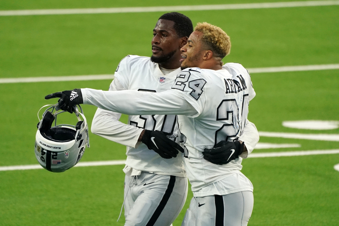 Nov 8, 2020; Inglewood, California, USA; Las Vegas Raiders strong safety Johnathan Abram (24) and cornerback Isaiah Johnson (31) celebrate at the end of the game against the Los Angeles Chargers at SoFi Stadium. The Raiders defeated the Chargers 31-26.  Mandatory Credit: Kirby Lee-USA TODAY Sports