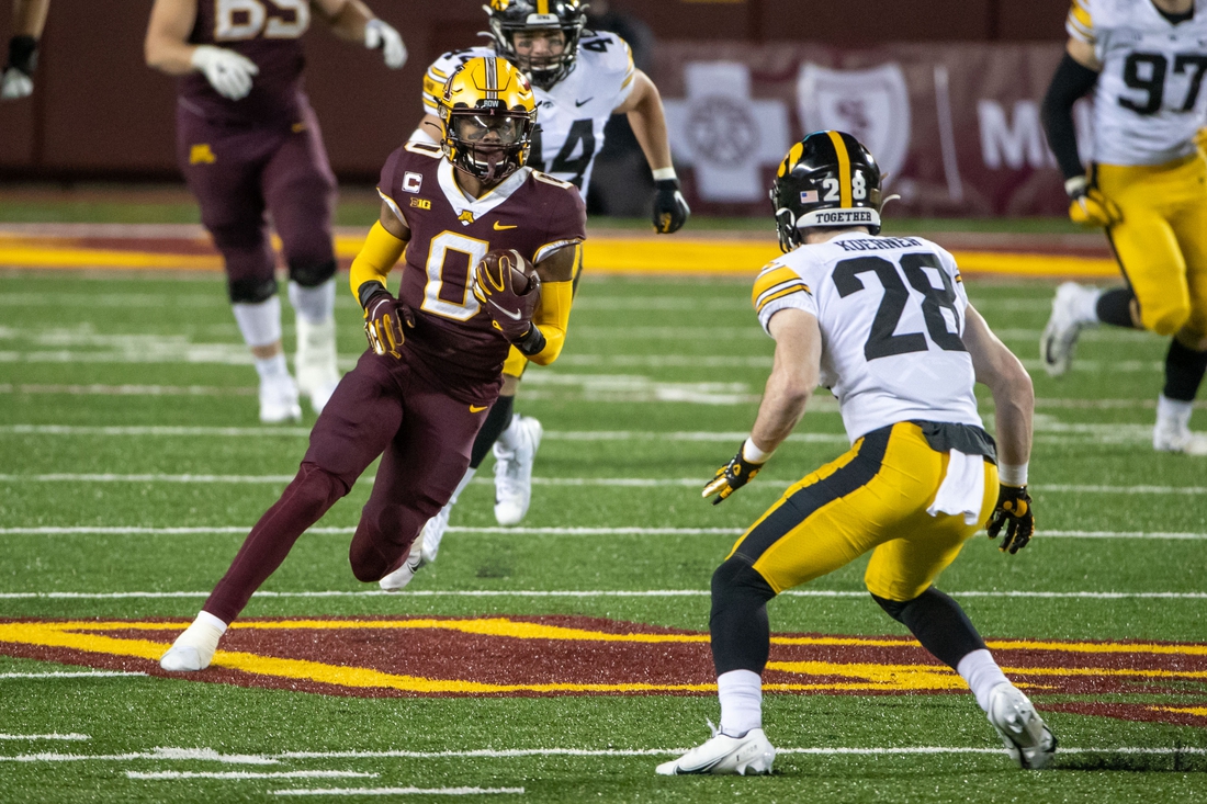 Nov 13, 2020; Minneapolis, Minnesota, USA; Minnesota Golden Gophers wide receiver Rashod Bateman (0) rushes with the ball after making a catch in the second half against the Iowa Hawkeyes at TCF Bank Stadium. Mandatory Credit: Jesse Johnson-USA TODAY Sports