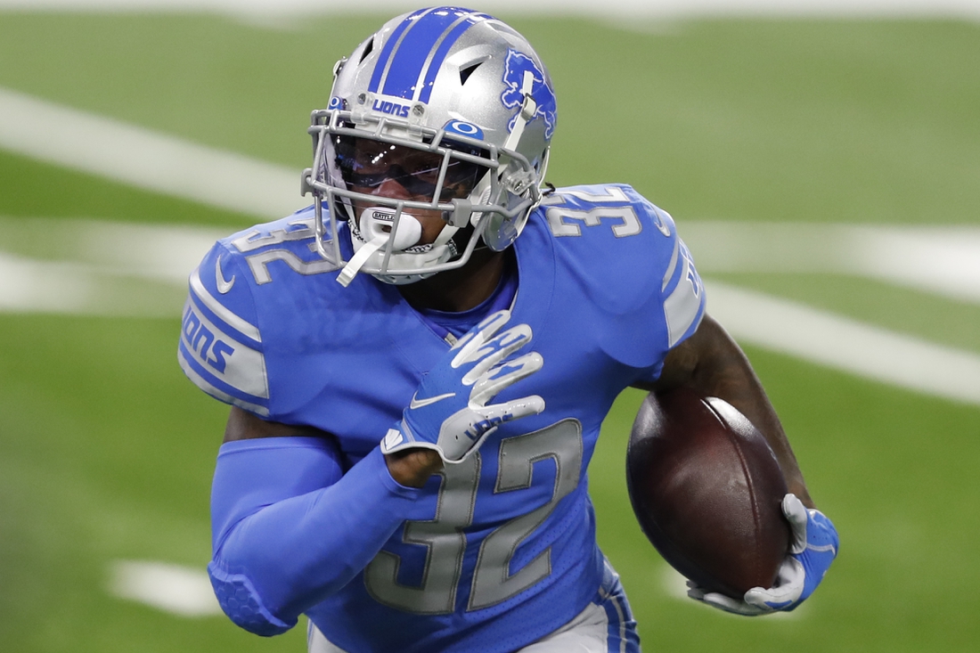 Nov 15, 2020; Detroit, Michigan, USA; Detroit Lions running back D'Andre Swift (32) runs the ball during the first quarter against the Washington Football Team at Ford Field. Mandatory Credit: Raj Mehta-USA TODAY Sports
