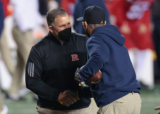 Nov 21, 2020; Piscataway, New Jersey, USA; Rutgers Scarlet Knights head coach Greg Schiano, left, shakes hands with Michigan Wolverines head coach Jim Harbaugh before their game at SHI Stadium. Mandatory Credit: Vincent Carchietta-USA TODAY Sports