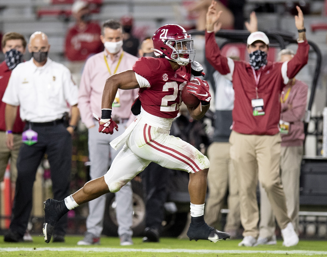 Nov 21, 2020; Tuscaloosa, Alabama, USA; Alabama Crimson Tide running back Jase McClellan (21) scores a touchdown against the Kentucky Wildcats on a fourth down play at Bryant-Denny Stadium. Mandatory Credit: Mickey Welsh/The Montgomery Advertiser via USA TODAY Sports