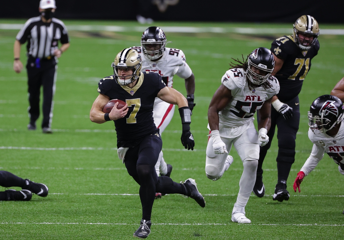 Nov 22, 2020; New Orleans, Louisiana, USA; New Orleans Saints quarterback Taysom Hill (7) runs against the Atlanta Falcons during the second half at the Mercedes-Benz Superdome. Mandatory Credit: Derick E. Hingle-USA TODAY Sports