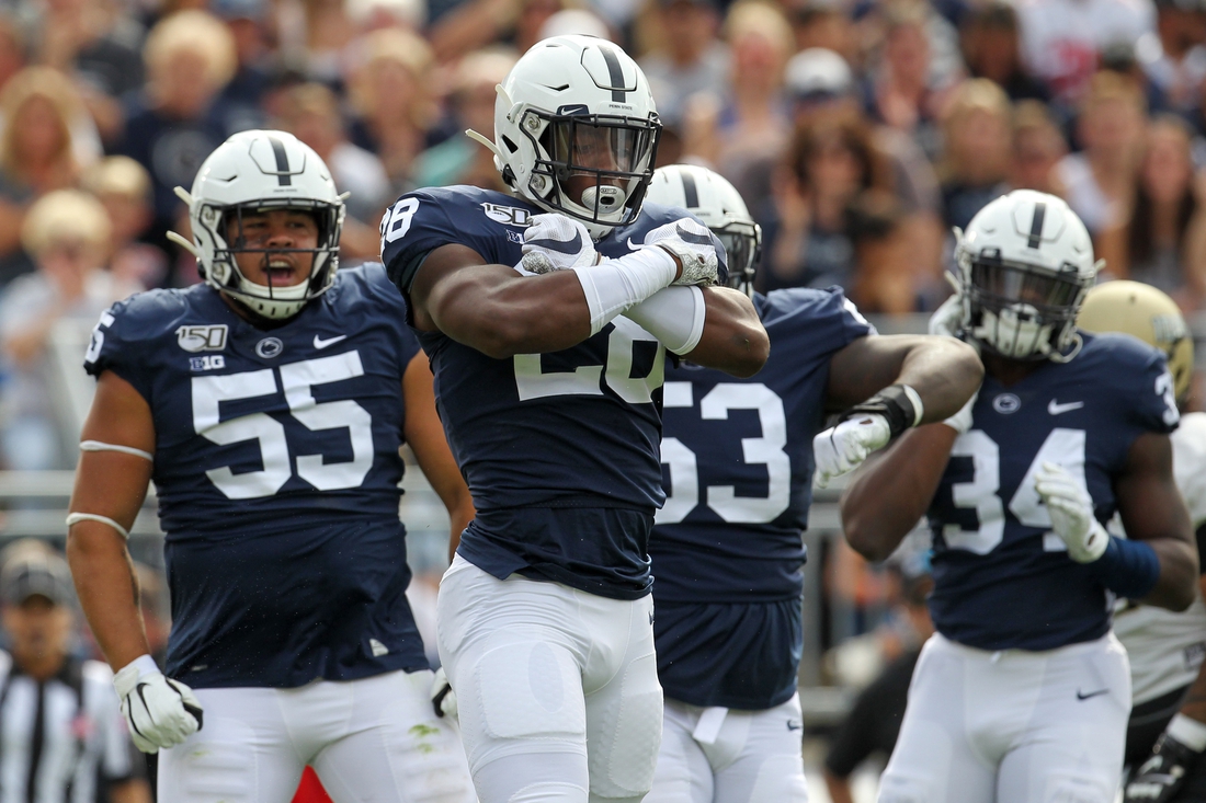 Aug 31, 2019; University Park, PA, USA; Penn State Nittany Lions defensive end Jayson Oweh (28) reacts following a sack during the first quarter against the Idaho Vandals at Beaver Stadium. Mandatory Credit: Matthew O'Haren-USA TODAY Sports