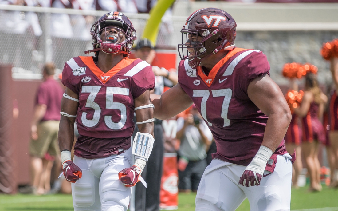 Sep 7, 2019; Blacksburg, VA, USA; Virginia Tech Hokies running back Keshawn King 935) celebrates his first touch down with Christian Darrisaw (77) in the first period against the Old Dominion Monarchs at Lane Stadium. Mandatory Credit: Lee Luther Jr.-USA TODAY Sports
