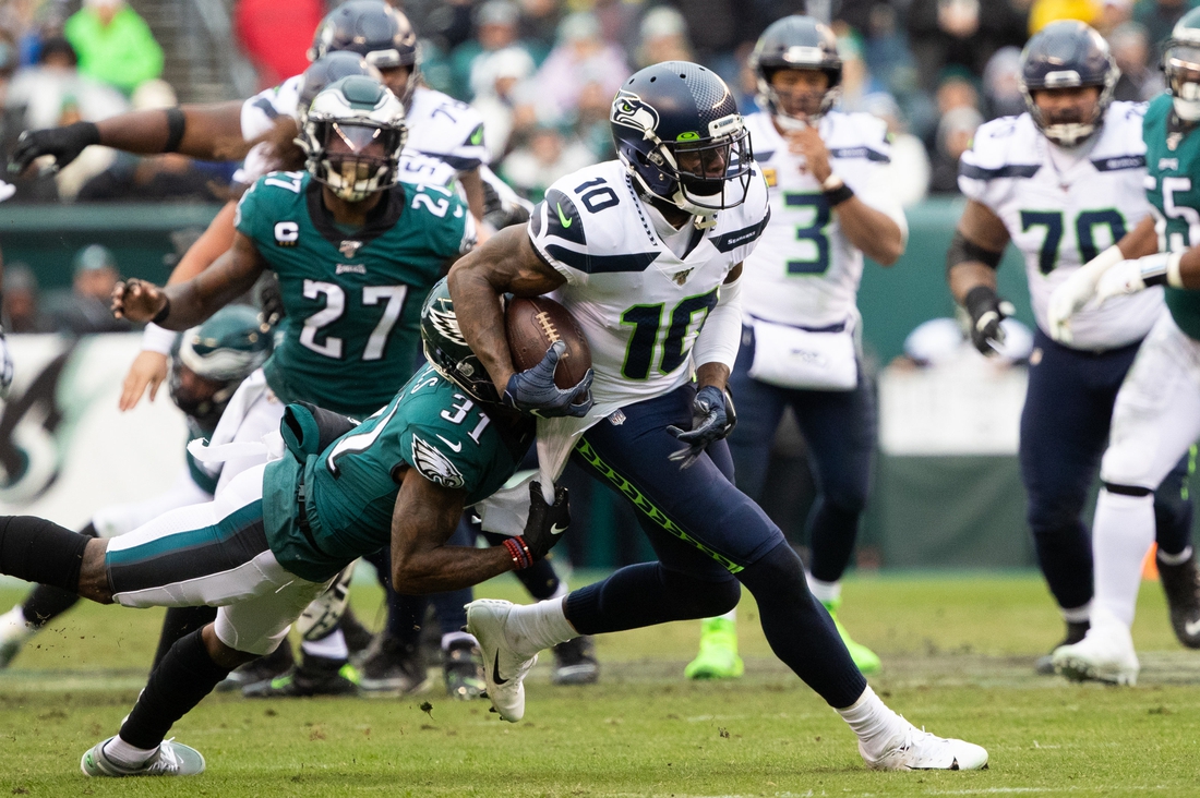 Nov 24, 2019; Philadelphia, PA, USA; Seattle Seahawks wide receiver Josh Gordon (10) catches the ball and is tackled by Philadelphia Eagles cornerback Jalen Mills (31) during the second quarter at Lincoln Financial Field. Mandatory Credit: Bill Streicher-USA TODAY Sports