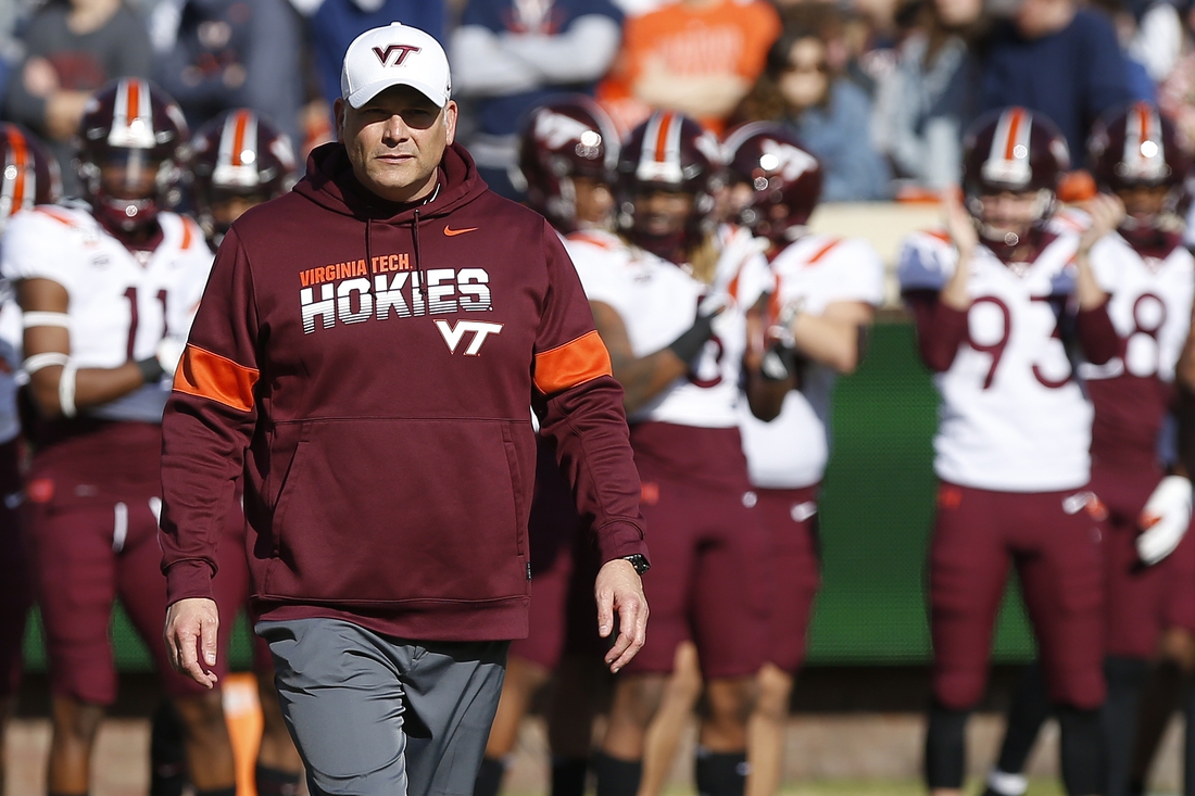 Nov 29, 2019; Charlottesville, VA, USA; Virginia Tech Hokies head coach Justin Fuente stands on the field during warm-ups prior to the Cavaliers  game against the Virginia Tech Hokies at Scott Stadium. Mandatory Credit: Geoff Burke-USA TODAY Sports