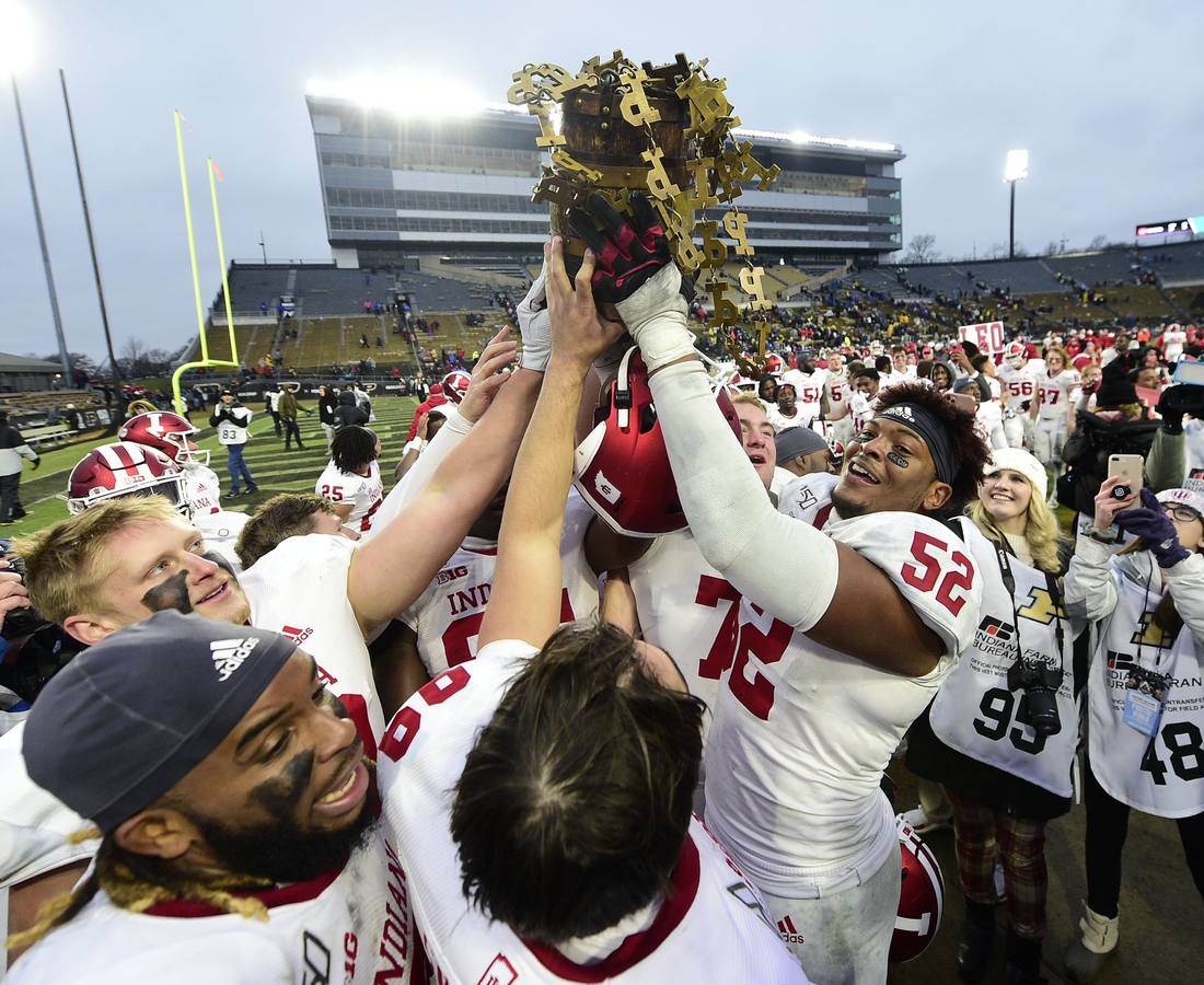 Nov 30, 2019; West Lafayette, IN, USA; Indiana Hoosiers players celebrate winning the Old Oaken Bucket by defeating the Purdue Boilermakers, 44-41 in 2 OT at Ross-Ade Stadium. Mandatory Credit: Thomas J. Russo-USA TODAY Sports
